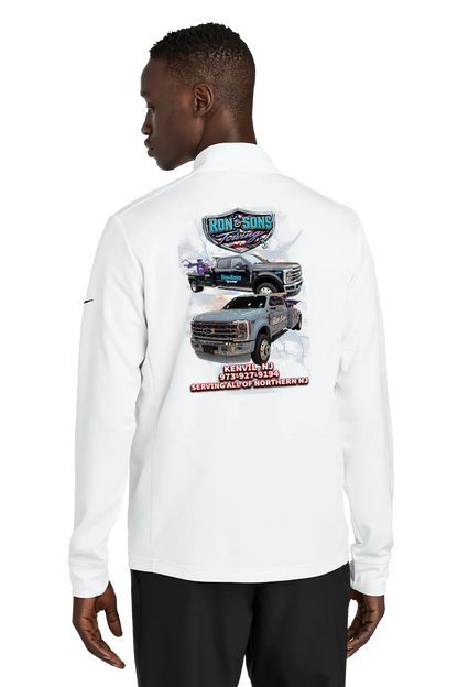 Person wearing a white long-sleeve shirt with graphics on the back, standing against a white background. Ron and Sons Towing, Paper Street Print Co, Blairstown, NJ.