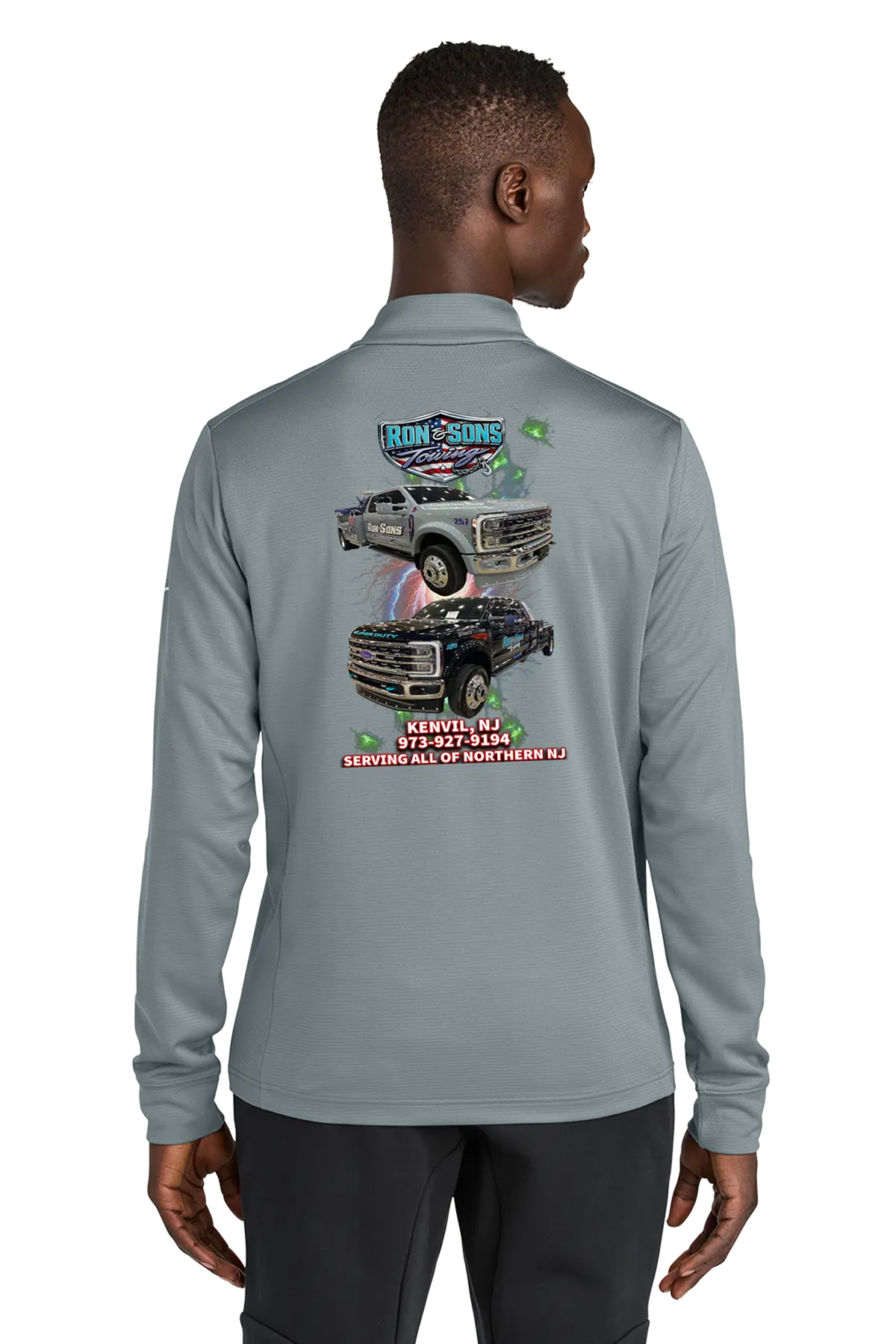 Person wearing a gray long-sleeve shirt with a graphic of a truck on the back, on a white background. Ron and Sons Towing, Paper Street Print Co, Blairstown, NJ.