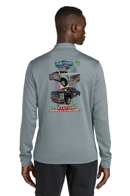 Person wearing a gray long-sleeve shirt with a graphic of a truck on the back, on a white background. Ron and Sons Towing, Paper Street Print Co, Blairstown, NJ.
