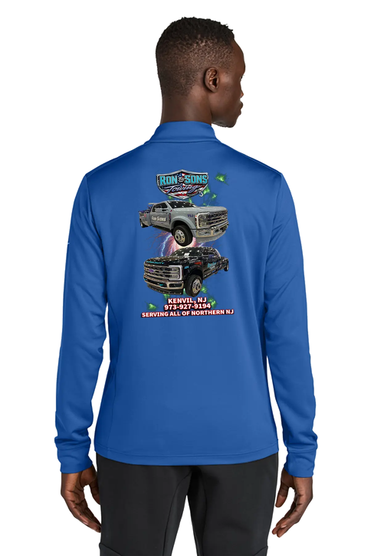 Person wearing a blue long-sleeve shirt with graphics on the back, standing against a white background. Ron and Sons Towing, Paper Street Print Co, Blairstown, NJ.