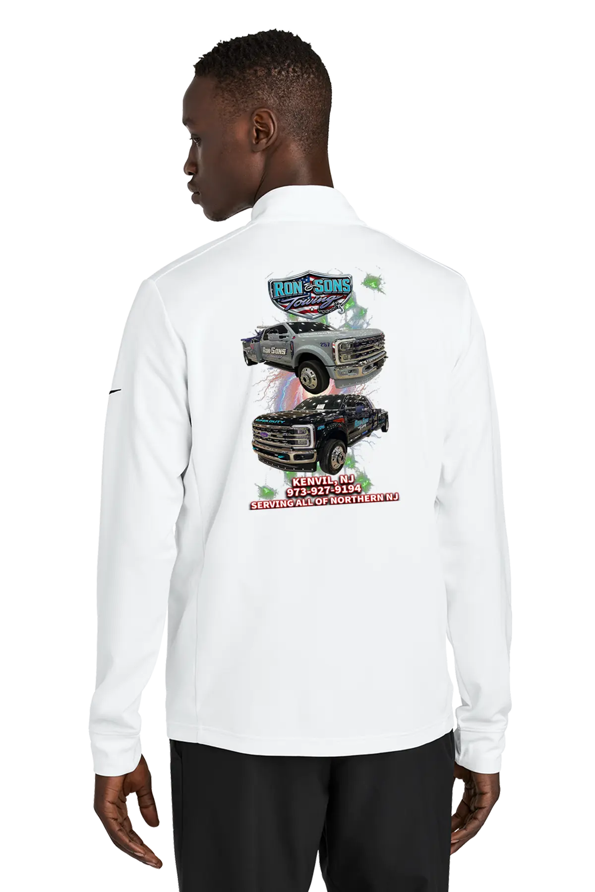 Person wearing a white long-sleeve shirt with graphics on the back, standing against a white background. Ron and Sons Towing, Paper Street Print Co, Blairstown, NJ.