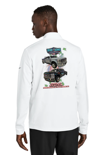 Person wearing a white long-sleeve shirt with graphics on the back, standing against a white background. Ron and Sons Towing, Paper Street Print Co, Blairstown, NJ.