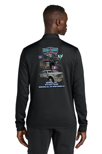 Person wearing a black long-sleeve shirt with graphics and text on the back, on a white background. Ron and Sons Towing, Paper Street Print Co, Blairstown, NJ.
