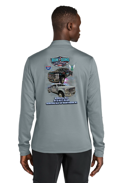 Person wearing a gray long-sleeve shirt with a graphic design on the back, standing against a white background. Ron and Sons Towing, Paper Street Print Co, Blairstown, NJ.