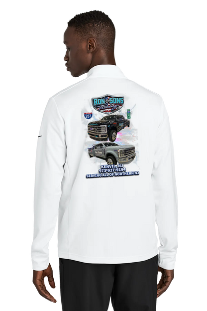 Person wearing a white long-sleeve shirt with graphic designs on the back, standing against a white background. Ron and Sons Towing, Paper Street Print Co, Blairstown, NJ.