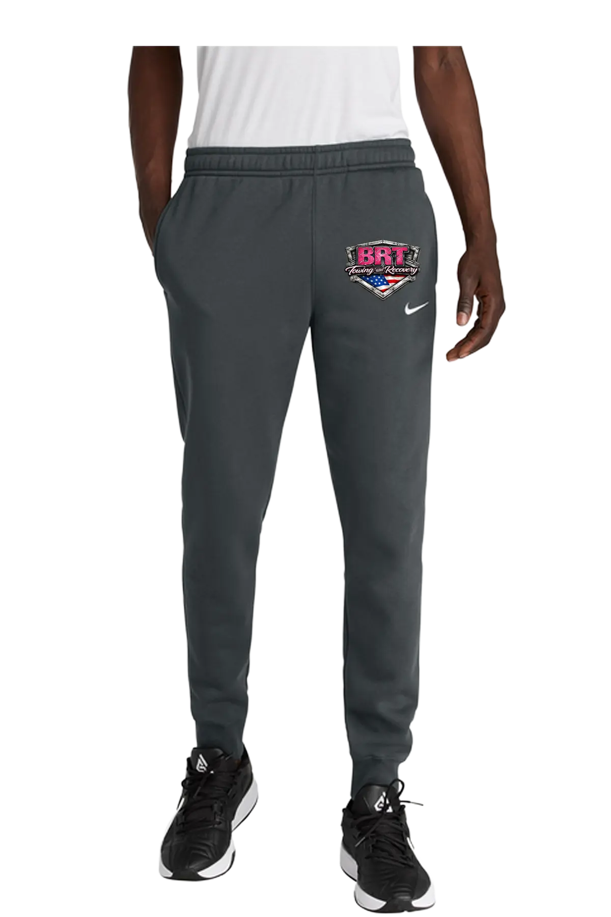 Person wearing gray sweatpants with a logo on a white background. BRT Towing and Recovery, Paper Street Print Co, Blairstown, NJ.