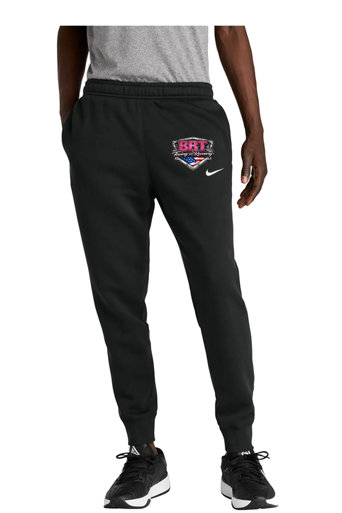 Person wearing black sweatpants with a logo and text, standing against a white background. BRT Towing and Recovery, Paper Street Print Co, Blairstown, NJ.