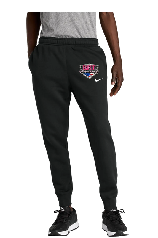 Person wearing black sweatpants with a logo and text, standing against a white background. BRT Towing and Recovery, Paper Street Print Co, Blairstown, NJ.