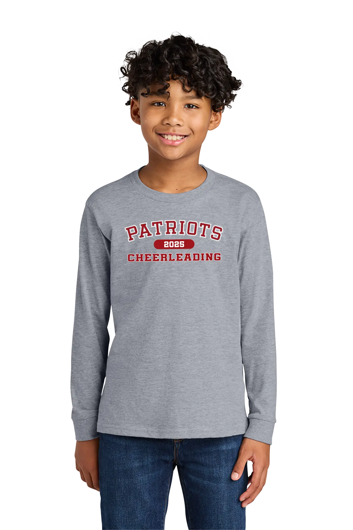 Child wearing a gray long-sleeve shirt with 'Patriots Cheerleading' text on a white background. Paper Street Print Co, Blairstown, NJ.