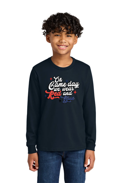 Child wearing a black long-sleeve shirt with colorful text on a white background. Paper Street Print Co, Blairstown, NJ.