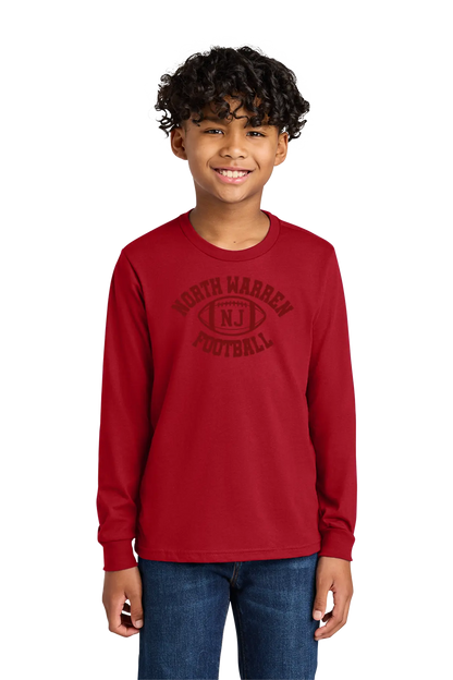 Child wearing a red long-sleeve shirt with 'North Warren Football' text on a white background. Paper Street Print Co, Blairstown, NJ.