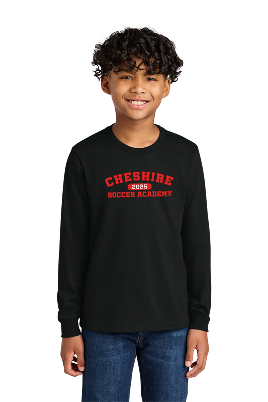 Child wearing a black long-sleeve shirt with 'Cheshire Soccer Academy' text on a white background. Paper Street Print Co, Blairstown, NJ.
