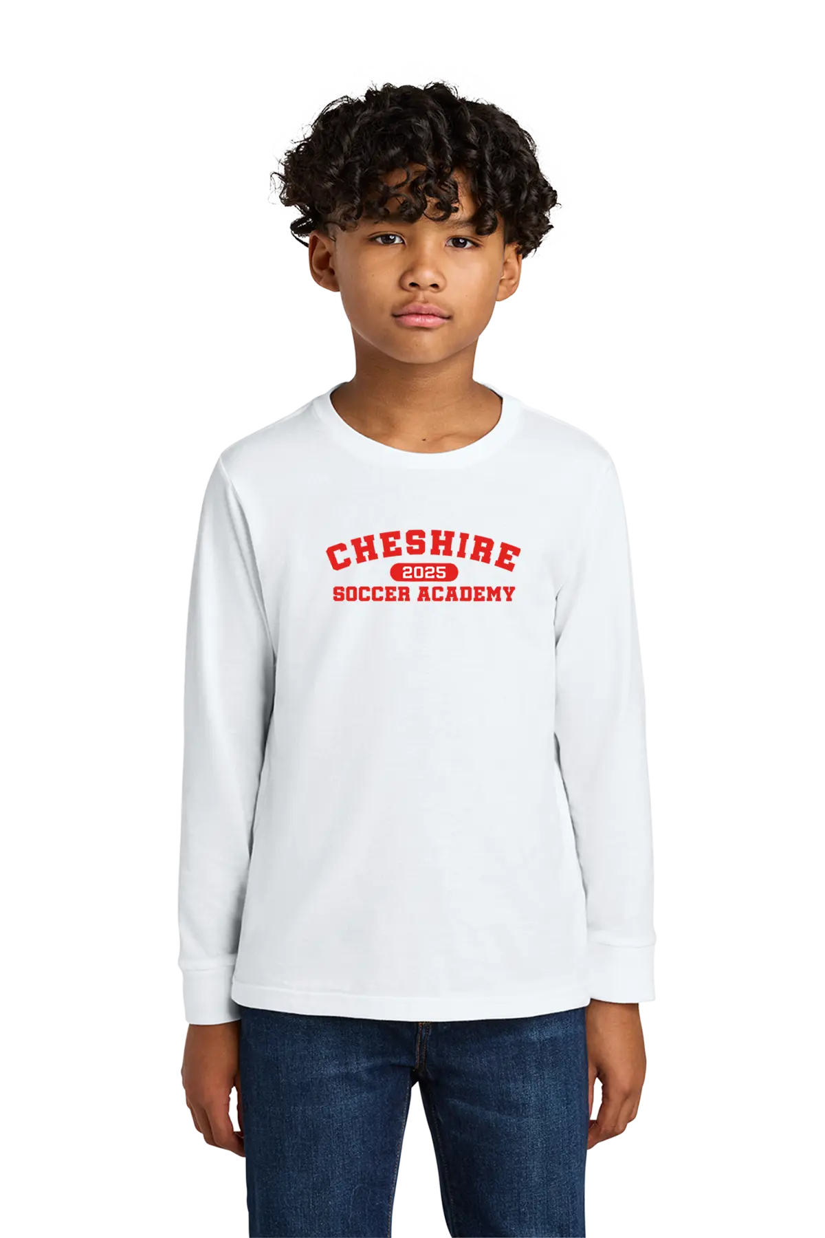 Child wearing a white long-sleeve shirt with 'Cheshire Soccer Academy' text on a white background. Paper Street Print Co, Blairstown, NJ.