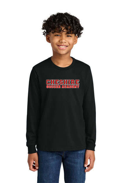 Child wearing a black long-sleeve shirt with 'Cheshire Soccer Academy' text on a white background. Paper Street Print Co, Blairstown, NJ.