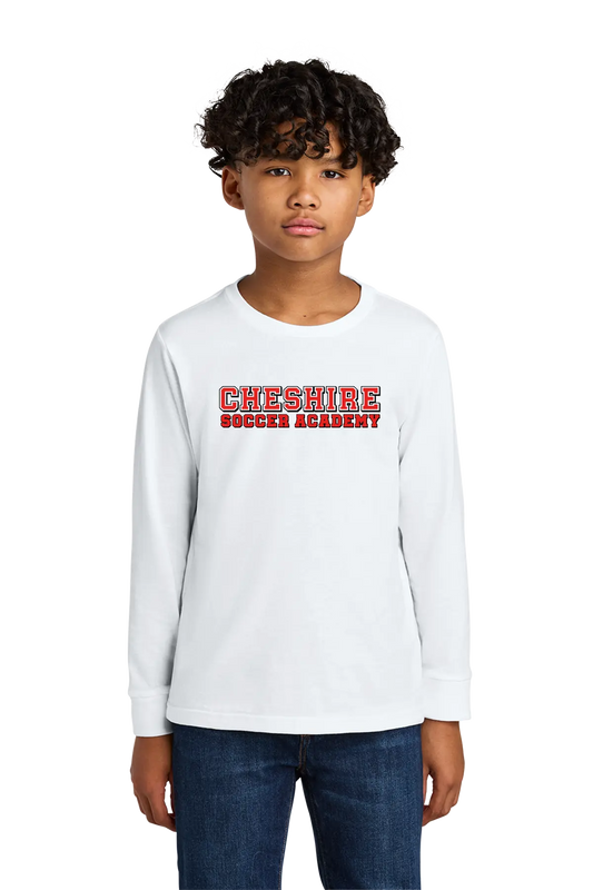 Child wearing a white long-sleeve shirt with 'Cheshire Soccer Academy' text on a white background. Paper Street Print Co, Blairstown, NJ.