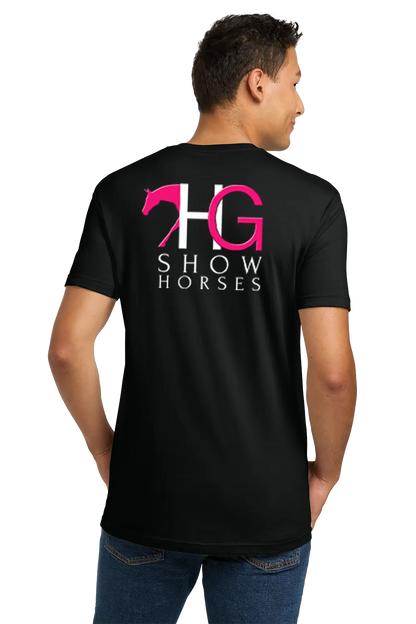 A man wearing a black t-shirt from the back, featuring a large graphic on the back with a pink horse silhouette, the letters 'HG' in white and pink, and the words 'SHOW HORSES' in white. He is also wearing blue jeans against a plain white background. HG Show Horses, Paper Street Print Co, Blairstown, NJ.