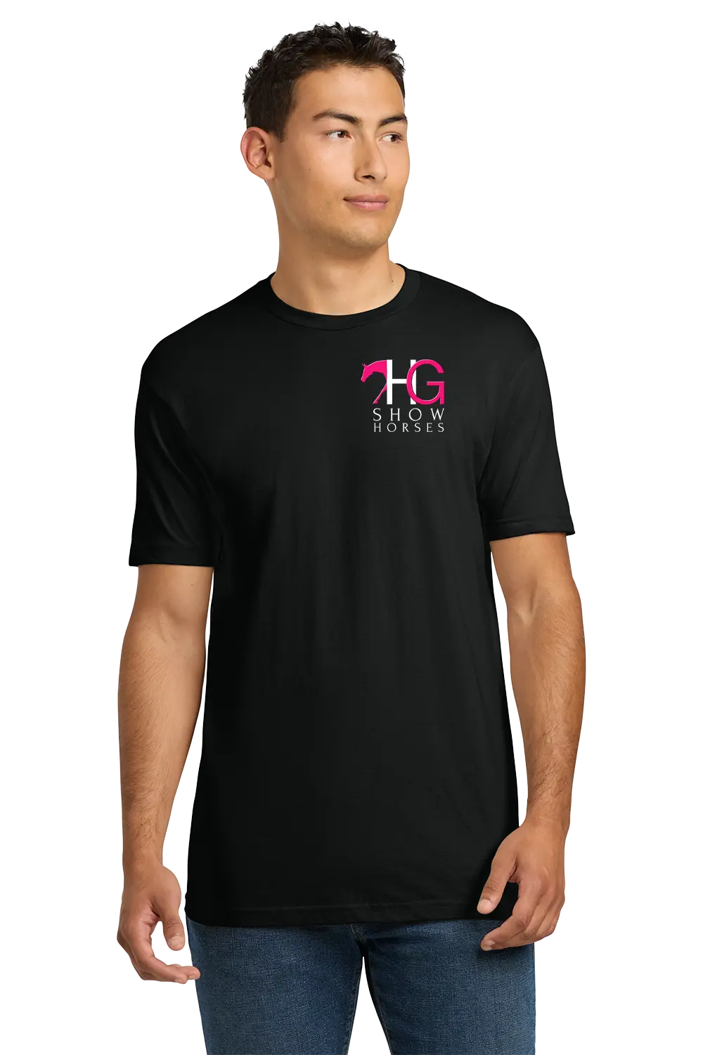 A man wearing a black short-sleeve crewneck t-shirt with a pink and white 'HG SHOW HORSES' logo on the left chest, paired with blue jeans, set against a plain white background. HG Show Horses, Paper Street Print Co, Blairstown, NJ.