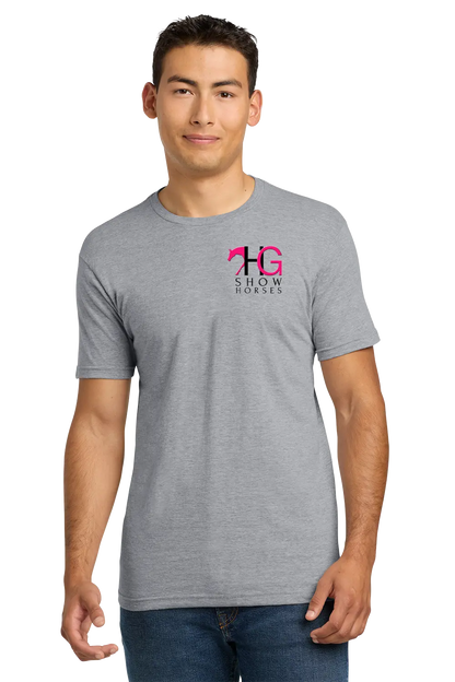A man wearing a heather gray short-sleeve t-shirt with a pink and black '14 Show Horse' graphic on the left chest, paired with blue jeans, against a plain white background. HG Show Horses, Paper Street Print Co, Blairstown, NJ.