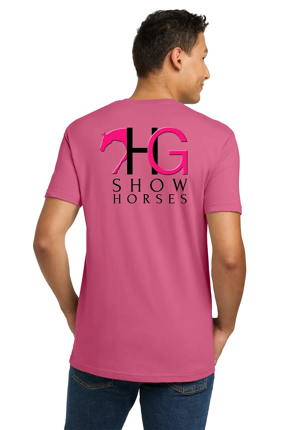 A man wearing a pink t-shirt from the back, featuring a large graphic print of a horse silhouette and the letters 'HG' with 'SHOW HORSES' underneath in black and pink. He is also wearing blue jeans against a plain white background. HG Show Horses, Paper Street Print Co, Blairstown, NJ.