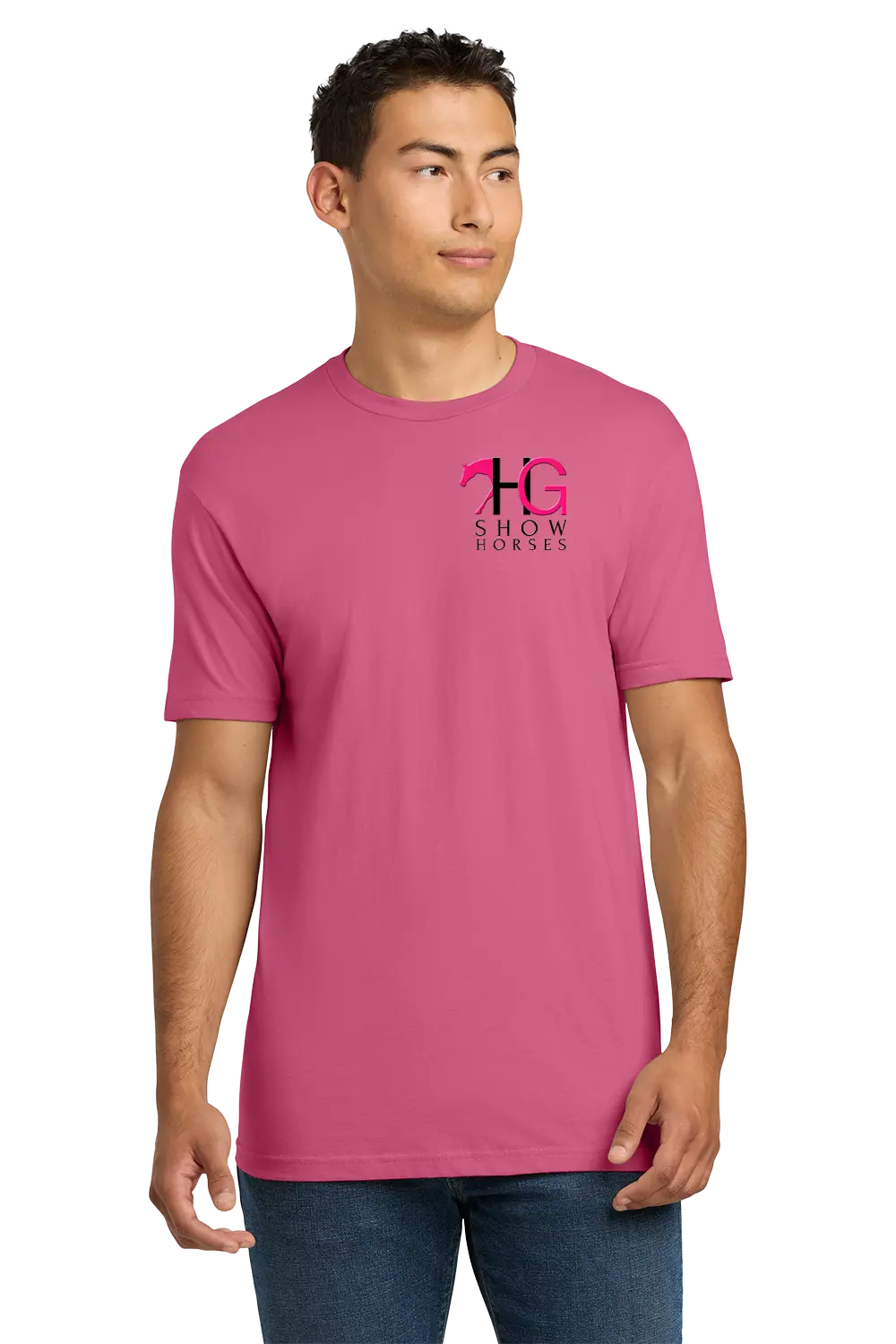 A man wearing a pink crewneck t-shirt with a pink and black 'HG Show Horses' logo on the left chest, paired with blue jeans, set against a plain white background. HG Show Horses, Paper Street Print Co, Blairstown, NJ.