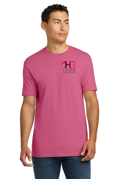 A man wearing a pink crewneck t-shirt with a pink and black 'HG Show Horses' logo on the left chest, paired with blue jeans, set against a plain white background. HG Show Horses, Paper Street Print Co, Blairstown, NJ.