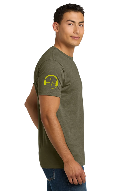 Man wearing an olive green t-shirt with a yellow graphic on the sleeve against a white background. Paper Street Print Co, Blairstown, NJ.