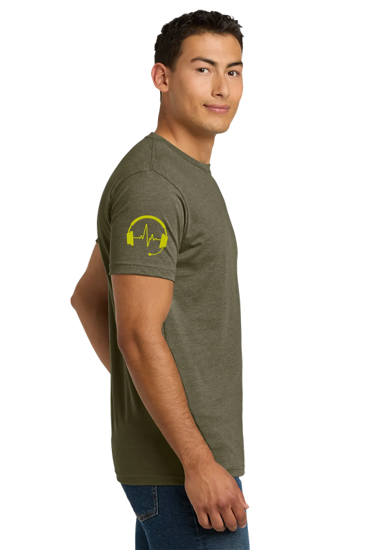 Man wearing an olive green t-shirt with a yellow graphic on the sleeve against a white background. Paper Street Print Co, Blairstown, NJ.