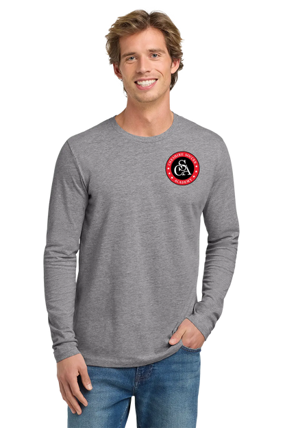 Man wearing a gray long-sleeve shirt with a logo on a white background. Paper Street Print Co, Blairstown, NJ.
