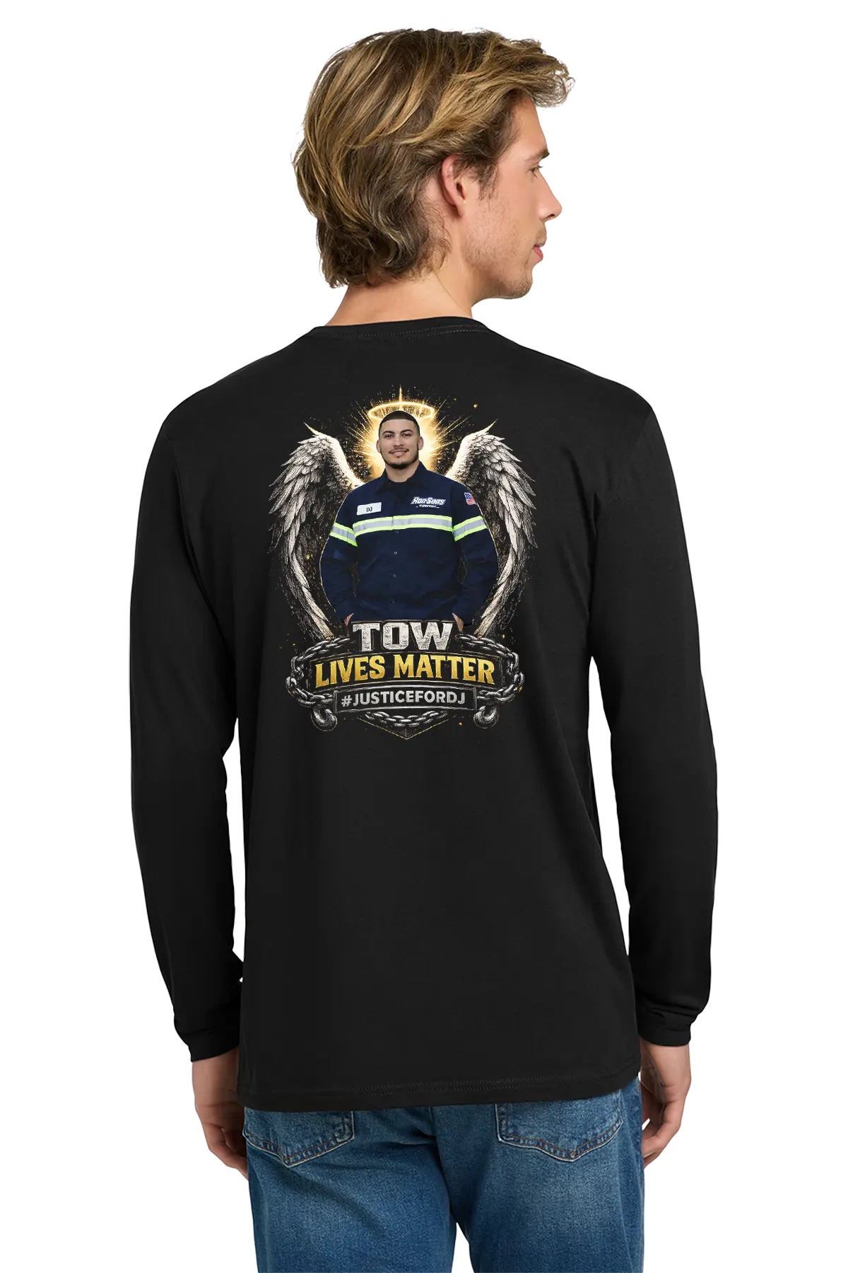 Person wearing a black long-sleeve shirt with a graphic design on the back, standing against a white background. #JUSTICEFORDJ - Paper Street Print Co, Blairstown, NJ.