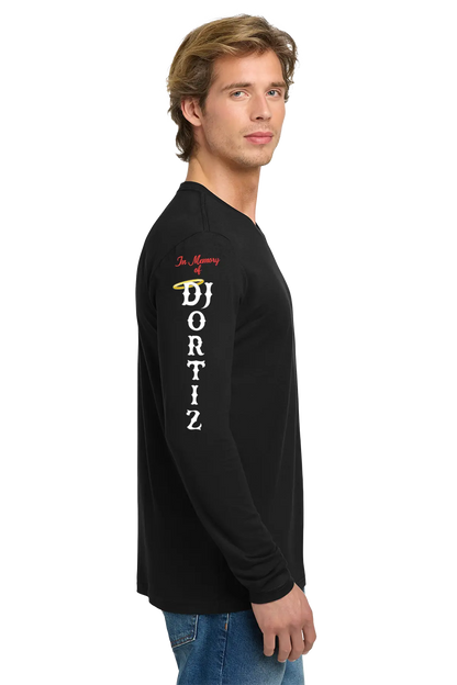 Man wearing a black long-sleeve shirt with text on the sleeve against a white background. #JUSTICEFORDJ - Paper Street Print Co, Blairstown, NJ.