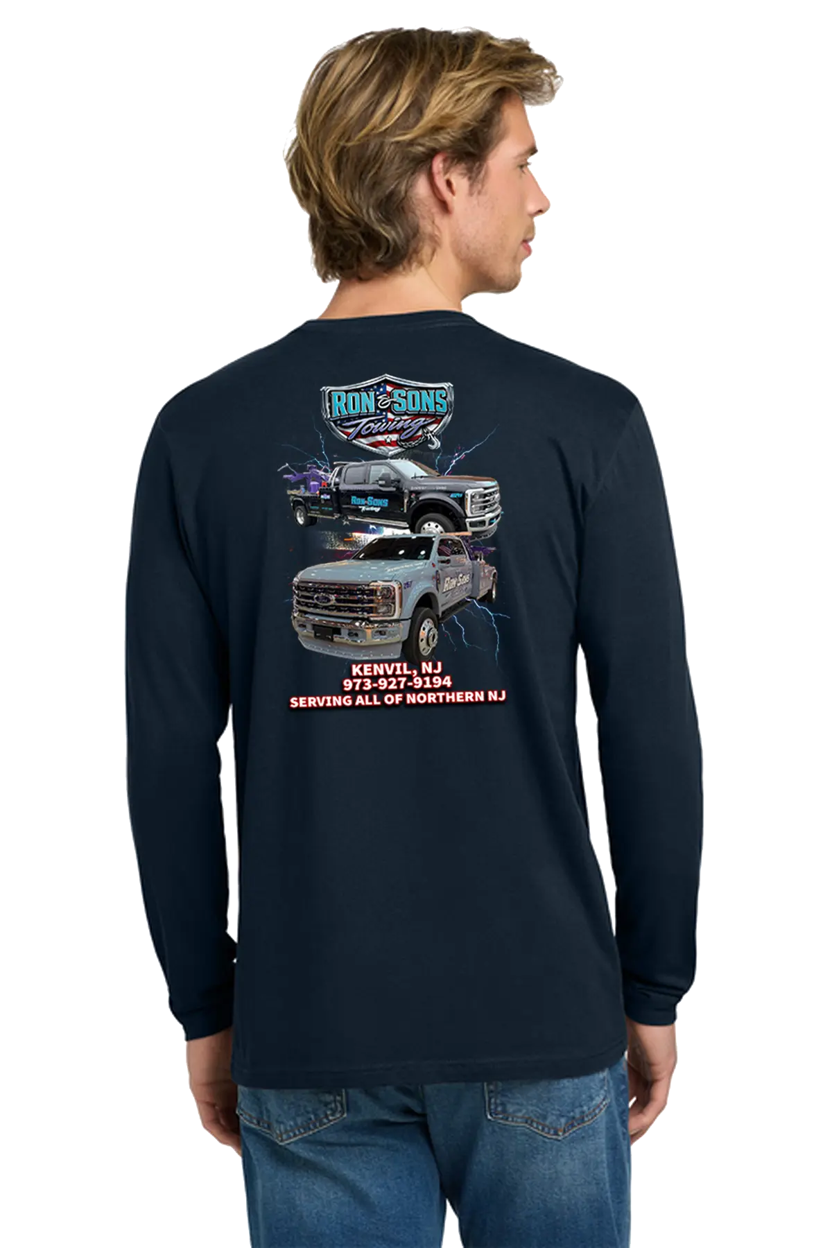 Man wearing a navy long-sleeve shirt with graphics and text on the back, standing against a white background. Ron and Sons Towing, Paper Street Print Co, Blairstown, NJ.