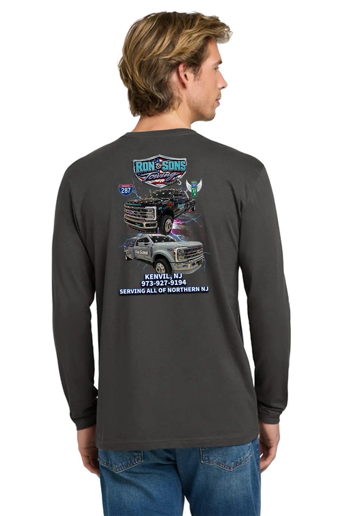 Person wearing a long-sleeve shirt with graphics and text on the back, standing against a white background. Ron and Sons Towing, Paper Street Print Co, Blairstown, NJ.