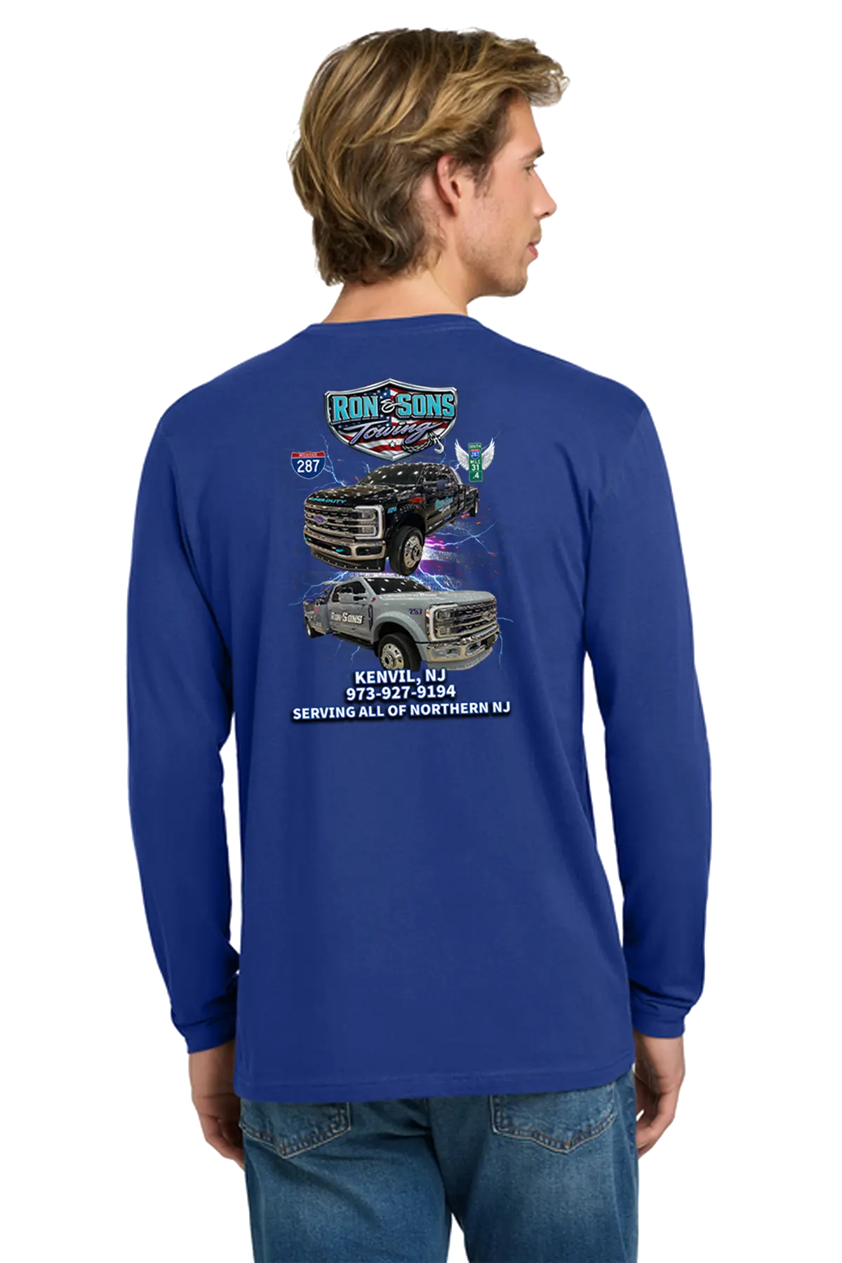 Man wearing a blue long-sleeve shirt with graphics and text on the back, standing against a white background. Ron and Sons Towing, Paper Street Print Co, Blairstown, NJ.