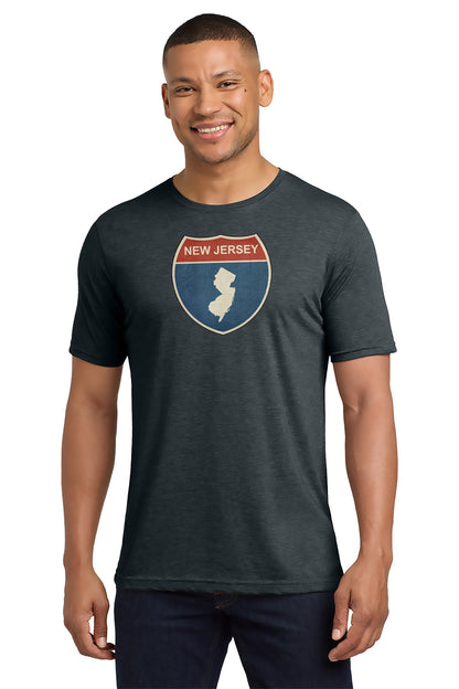 Man wearing a dark gray t-shirt with a New Jersey graphic design on a white background - Paper Street Print Co, Blairstown, NJ