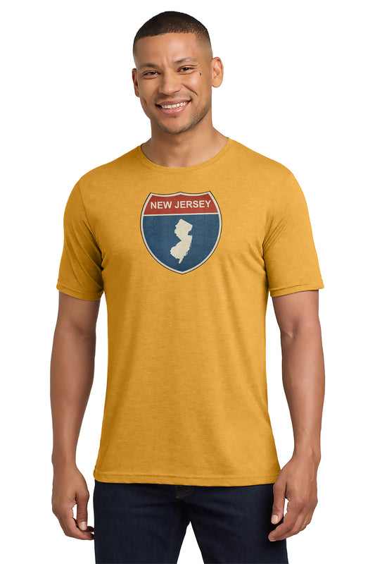 Man wearing a mustard yellow t-shirt with a New Jersey graphic design on a white background - Paper Street Print Co, Blairstown, NJ