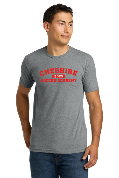 Man wearing a gray t-shirt with 'Cheshire Soccer Academy 2025' text on a white background. Paper Street Print Co, Blairstown, NJ.