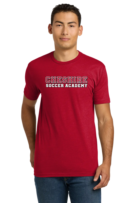 Person wearing a red 'Cheshire Soccer Academy' t-shirt on a white background. Paper Street Print Co, Blairstown, NJ.