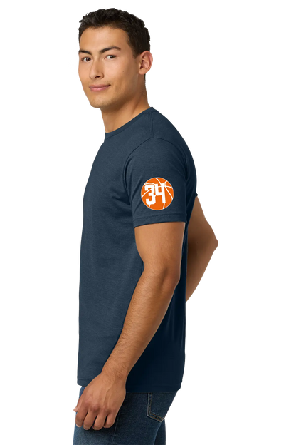 Man wearing a navy blue t-shirt with a logo on the sleeve against a white background. Paper Street Print Co, Blairstown, NJ.