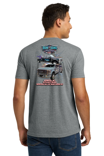 Person wearing a gray t-shirt with a graphic of a truck and text on the back. Ron and Sons Towing, Paper Street Print Co, Blairstown, NJ.