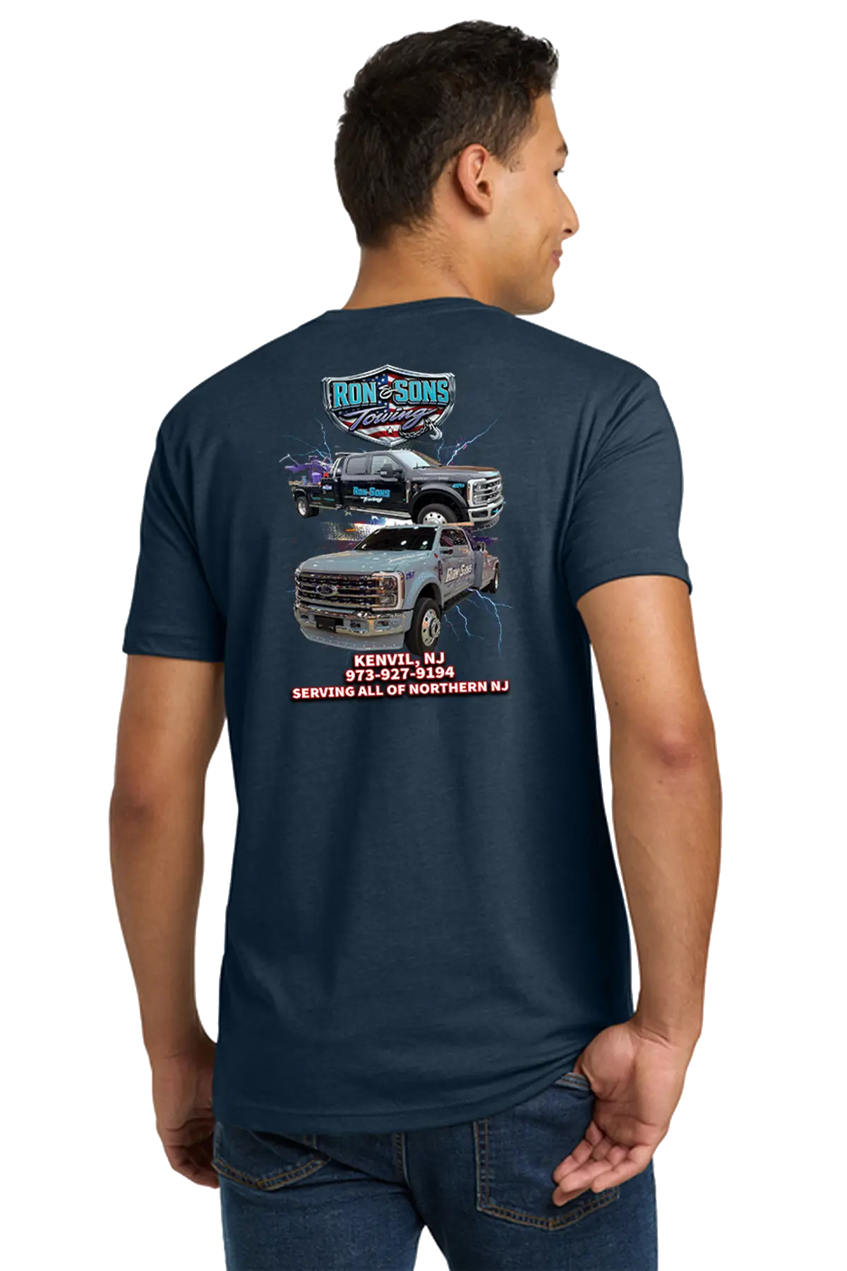Person wearing a navy blue t-shirt with graphics and text on the back, on a white background. Ron and Sons Towing, Paper Street Print Co, Blairstown, NJ.