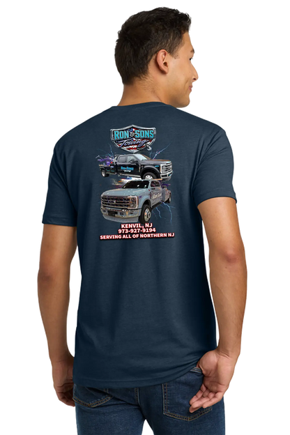 Person wearing a navy blue t-shirt with graphics and text on the back, on a white background. Ron and Sons Towing, Paper Street Print Co, Blairstown, NJ.