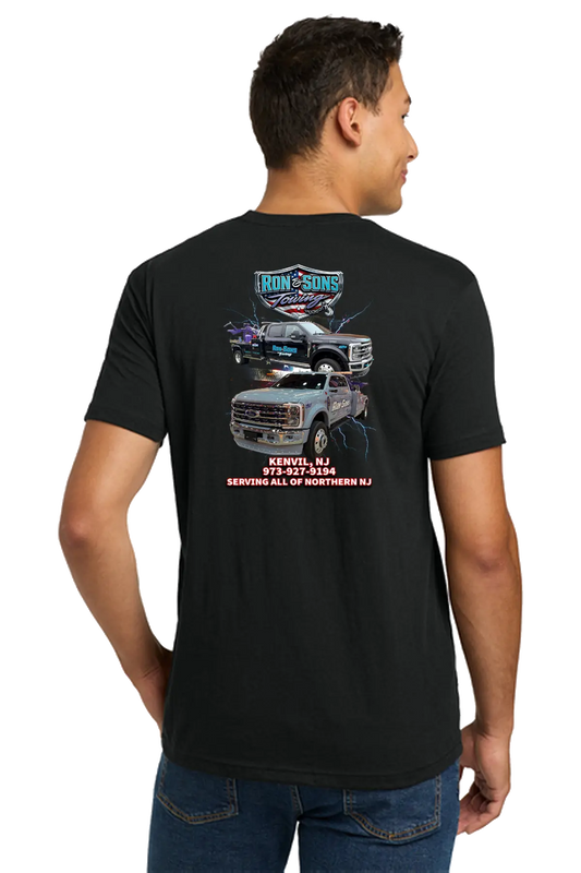 Man wearing a black t-shirt with a graphic design on the back, standing against a white background. Ron & Sons Towing, Paper Street Print Co, Blairstown, NJ.