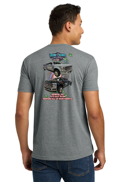 Person wearing a gray t-shirt with a graphic design on the back, standing against a white background. Ron and Sons Towing, Paper Street Print Co, Blairstown, NJ.