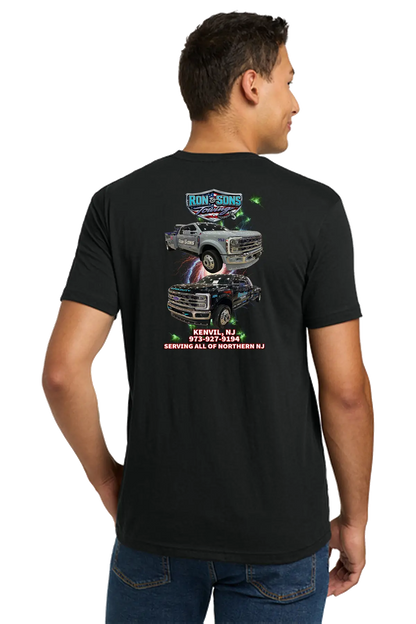 Man wearing a black t-shirt with graphic designs and text on the back. Ron & Sons Towing, Paper Street Print Co, Blairstown, NJ.