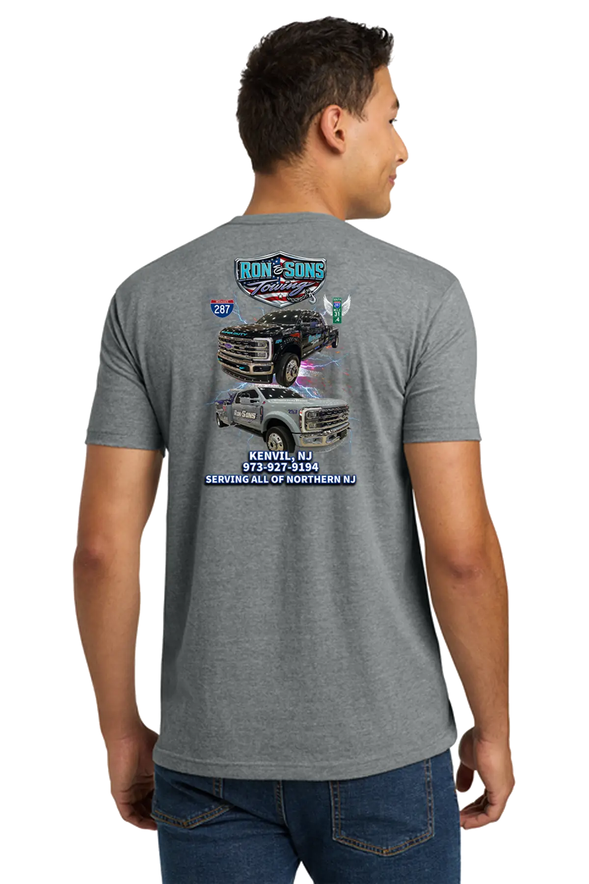 Person wearing a gray t-shirt with a graphic design on the back, standing against a white background. Ron and Sons Towing, Paper Street Print Co, Blairstown, NJ.
