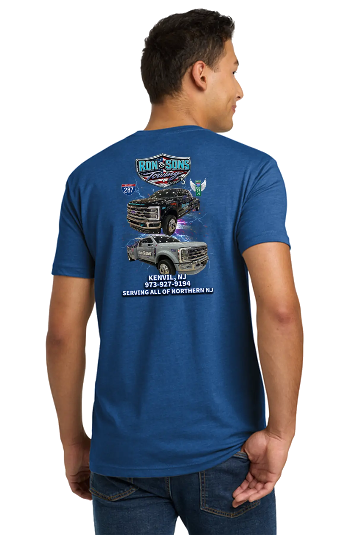Person wearing a blue t-shirt with graphics and text on the back, standing against a white background. Ron and Sons Towing, Paper Street Print Co, Blairstown, NJ.