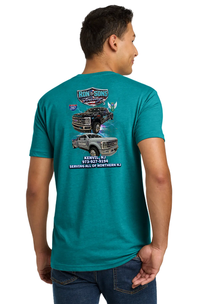 Person wearing a teal t-shirt with graphic designs on the back, standing against a white background. Ron and Sons Towing, Paper Street Print Co, Blairstown, NJ.