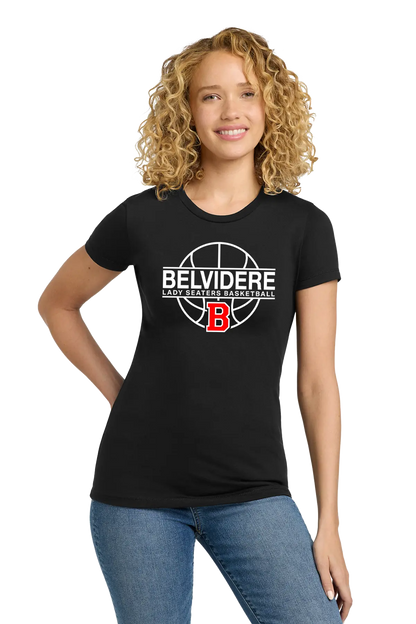 A woman with curly blonde hair wearing a black short-sleeve t-shirt with a white and red 'Belvidere Lady Seaters Basketball' graphic on the chest, paired with blue jeans, against a plain white background. Paper Street Print Co, Blairstown, NJ.