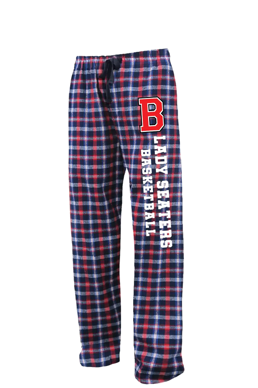 Plaid flannel lounge pants in navy, red, and white, featuring a large red 'B' logo and vertical white text reading 'LADIES BASKETBALL' on the left leg. Belvidere Lady Seaters Basketball, Paper Street Print Co, Blairstown, NJ.