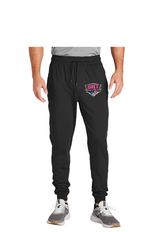 Black jogger pants with a logo on a white background. BRT Towing and Recovery, Paper Street Print Co, Blairstown, NJ.